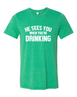 HE SEES YOU WHEN YOU'RE DRINKING BOUTIQUE TEE